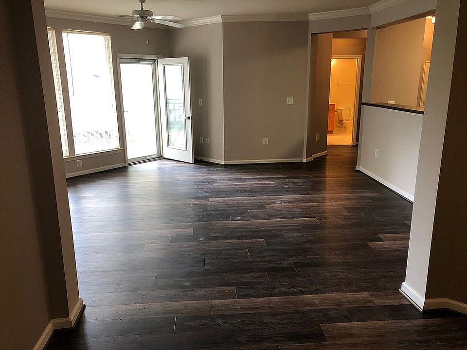 view from dining room into living room, with door to patio on left.