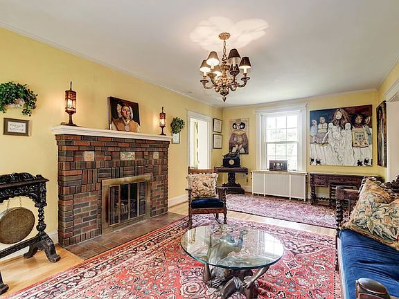 LIVING ROOM WITH STONE FIREPLACE