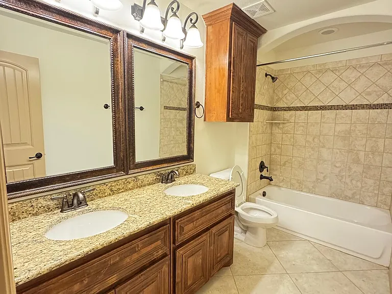 Full bath with dual sink on the second floor