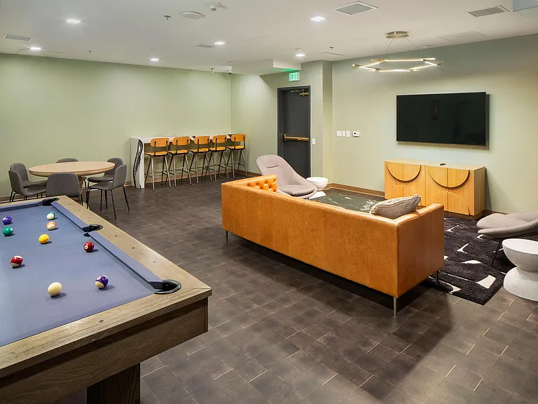Game room with pool table, card table, and smart TV