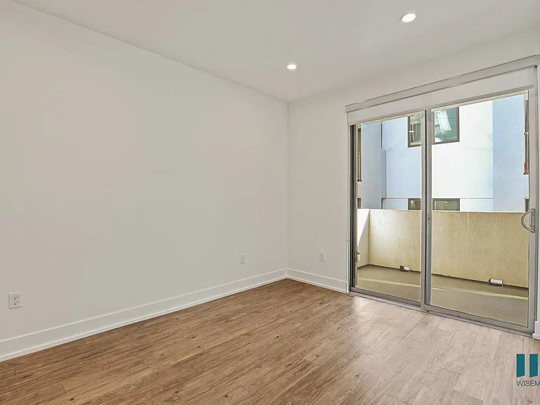 Living Room with Large-Size Windows, Patio, Recessed Lighting, and Vinyl Flooring