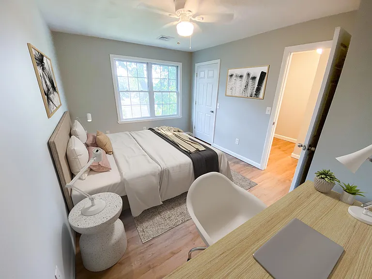 The second bedroom fits a queen bed as well as desk for WFH accessibility.