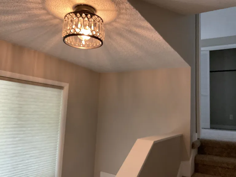 Hallway up to spacious bedroom