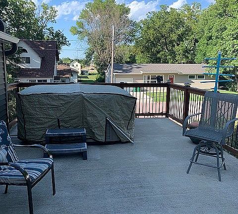 Deck by back door w/ hot tub