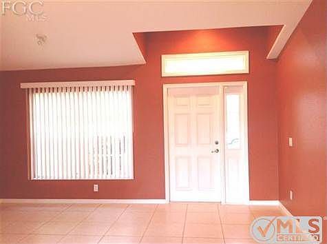 ENTER INTO A COMPLETELY TILED HOME. CATHEDRAL CEILING IN GREAT ROOM AND KITCHEN.