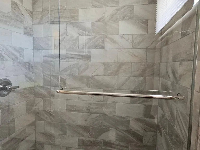 Built in shampoo and soap shelf.