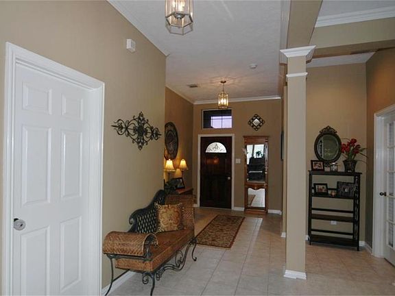 The front door opens to tile flooring, transom, crown molding and a fantastic floorplan.