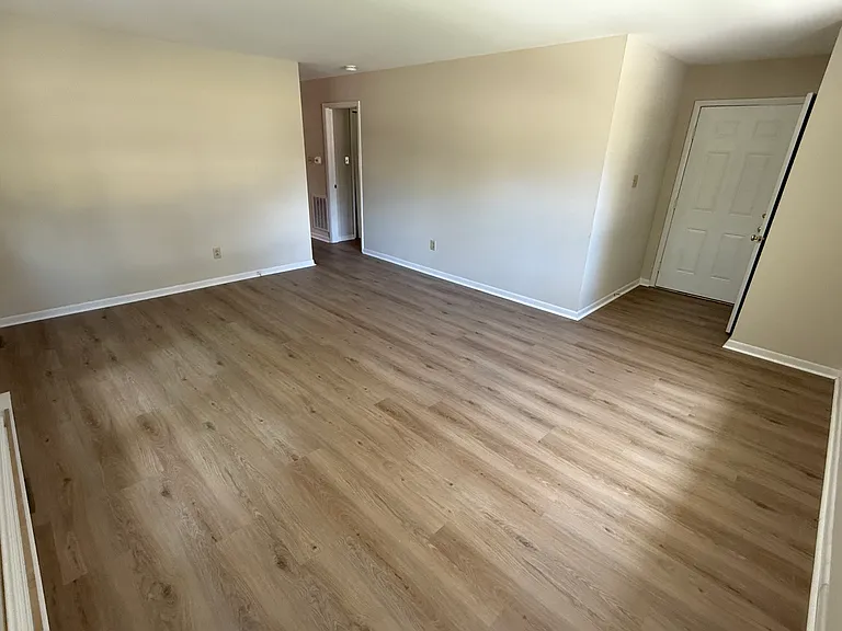 Enter into a spacious family room with gorgeous brand new luxury plank flooring.
