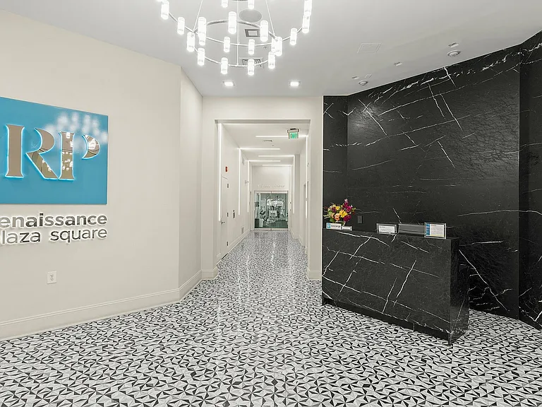 Explore the sophisticated entrance of Renaissance Plaza Square, where luxury meets design.