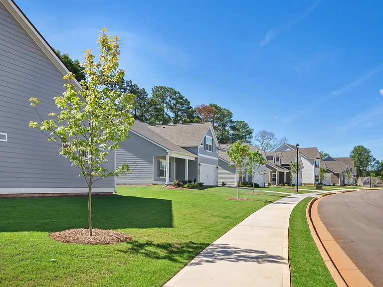 Exterior shot of Salem Oaks, two story homes with a private driveway and attached garage.