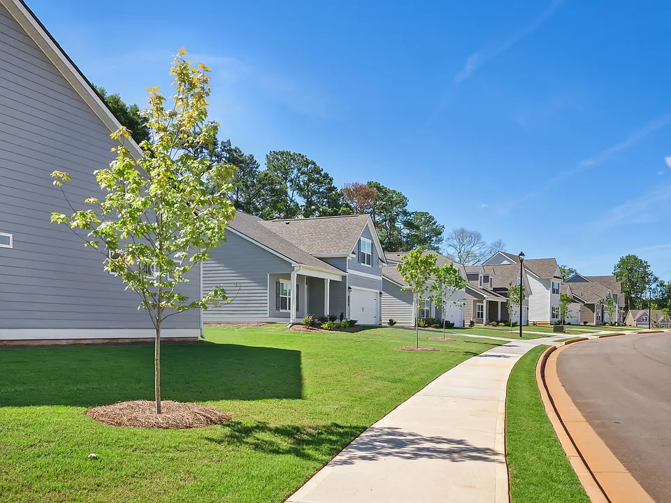 Exterior shot of Salem Oaks, two story homes with a private driveway and attached garage.