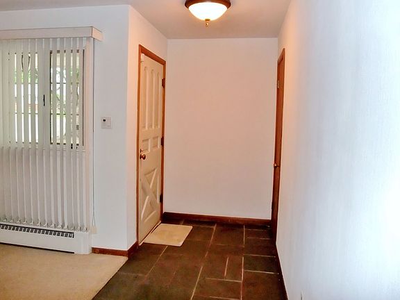 Entry with stone tile.
