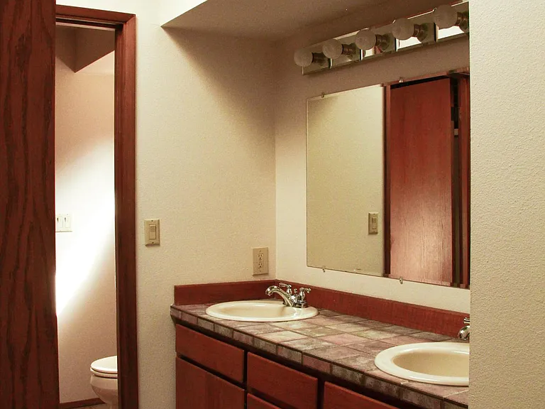 Master bedroom with double sink.