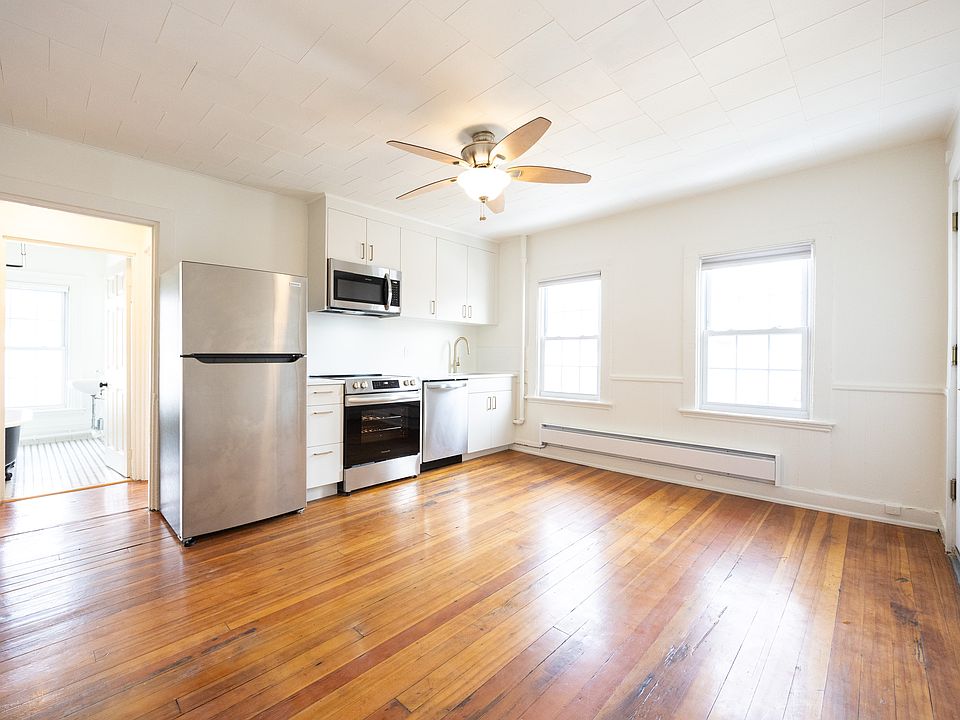 Open living room and kitchen with custom-built cabinetry