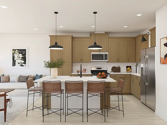 Kitchen with pendant lighting and floating shelves