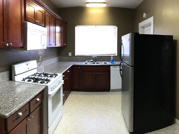 Kitchen comes with major appliances, cabinets, and granite counter tops. Linoleum for easy cleaning with swifter.