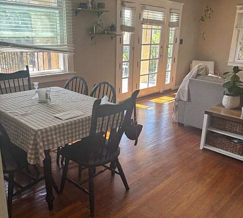 Living room and dining room with furniture.