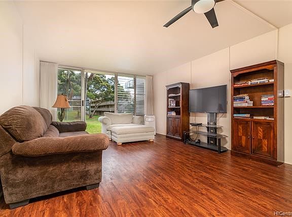 Upon entering this condo, you may enjoy an extended Green View of the Courtyard. Not seen in this photo is the One Bedroom, located on the rear side of the entertainment wall. Remodeled in 2016 with wood-like vinyl plank flooring; allowing  for easy care,& consistent with Island Indoor-Outdoor lifestyle