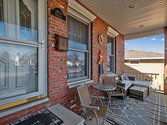 This front porch is deep enough for a chaise lounge, table and chairs.