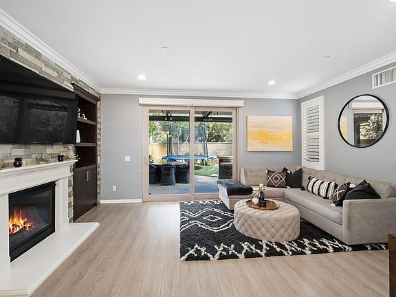 Living Room with Fireplace and sliding door to patio and yard