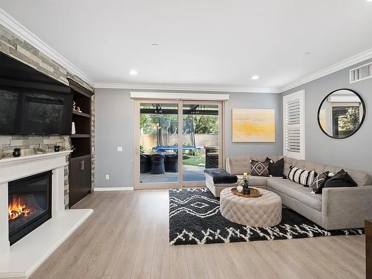 Living Room with Fireplace and sliding door to patio and yard