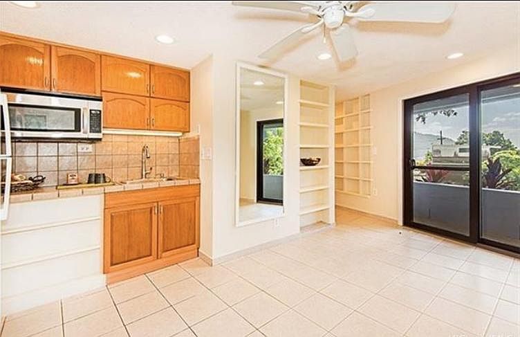 Living room area. Wet bar to the left. Space for your own cozy living room.
