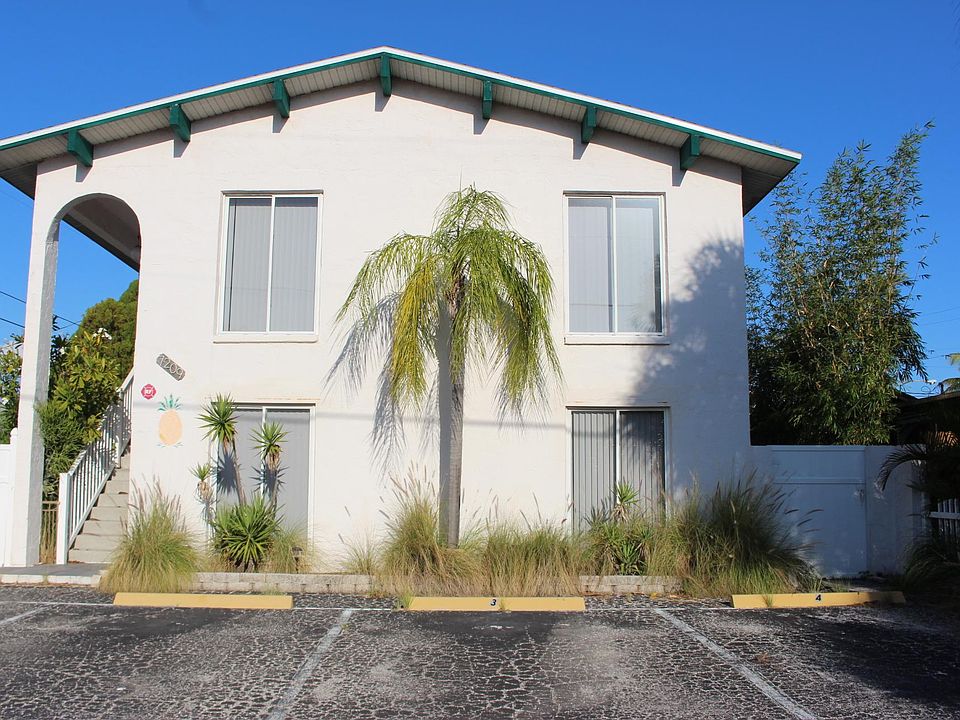The outside of the building with off-street parking