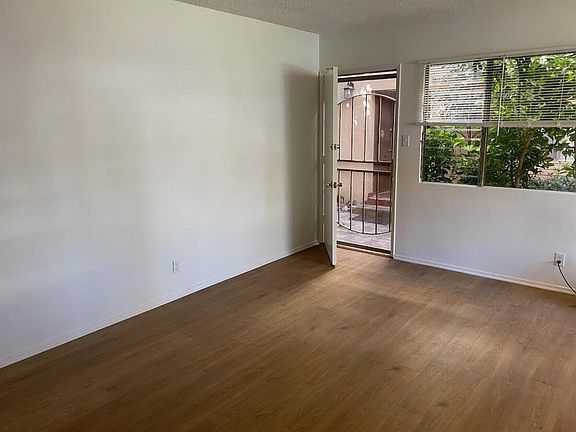 LIVING ROOM - PHOTO 1 
NOTICE THE BEAUTIFUL FLOORING