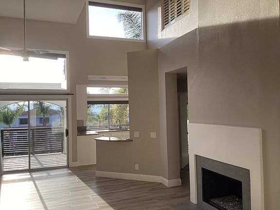 Living room with gas crystal fireplace. The kitchen is just past the fireplace on the right.
