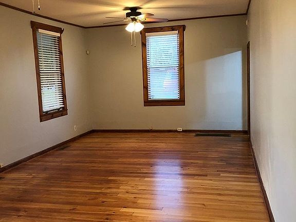 Open Living/Dining Area - Now light and bright with white walls.