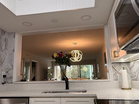 Enlarged custom opening from Kitchen to Living Room (other units have a much smaller opening)