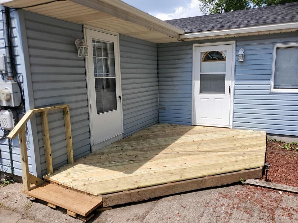 Apartment Entrance (right door) and Front Unit Back Door (left door) and Shared Deck