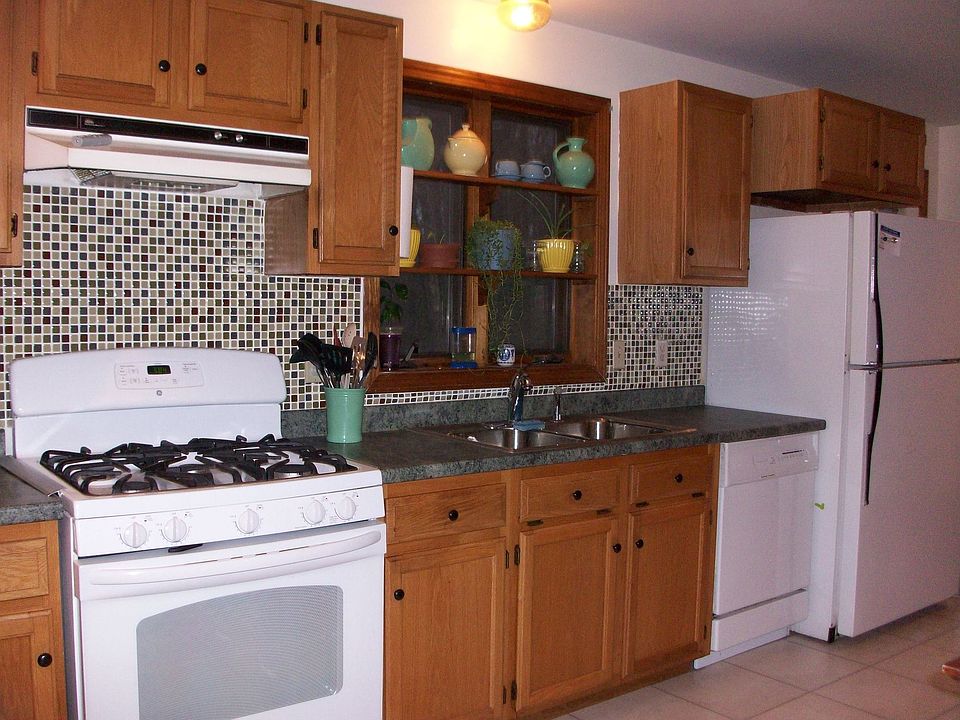 New stove, counters, glass tile backsplash