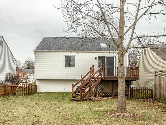 Deck and large fenced backyard.