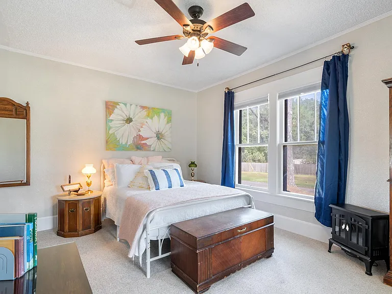 second bedroom with private entrance, electric fireplace and lots of storage