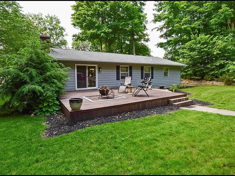 private back yard with hardwood deck and fire pit