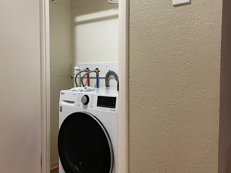 One of two closets in the bedroom area. This one has been fitted with washer/dryer hookup , but there are also washer and dryer hookups in the basement (washer/dryer not included)