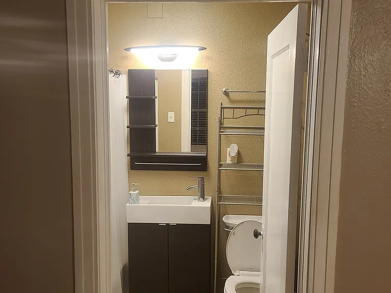 From bedroom into bathroom