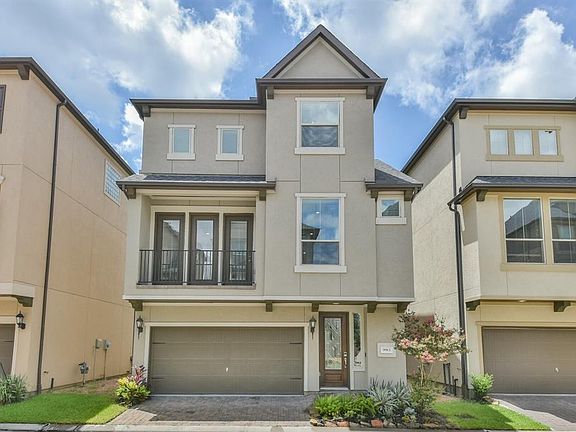 Fabulous three story Single Family home with two car garage, balcony and stunning elevation.