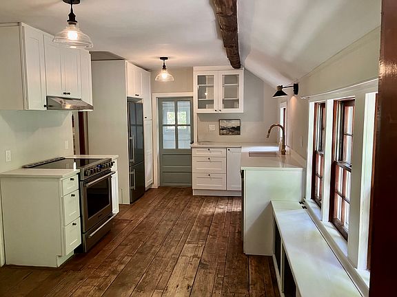 New kitchen, quartz counters, stainless, and wide plank floors