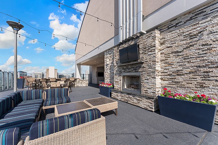 SkyDeck seating and fireplace with stunning city views