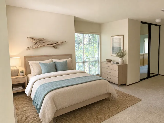 Staged for layout visualization; unit comes unfurnished" Master bedroom showing 2 different bed orientations.