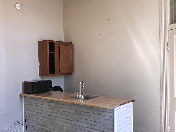 New bar covering and new flooring in kitchen