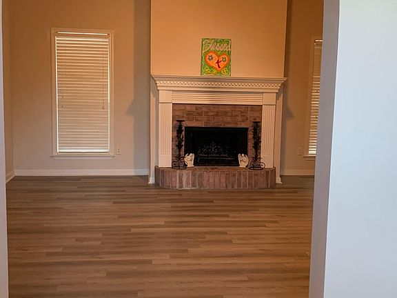 Formal living room with gas fireplace access from front entrance.