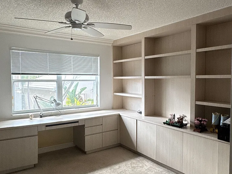 Upstairs bedroom #4. Built in cabinet and desk system. Can be used as an office or bedroom.