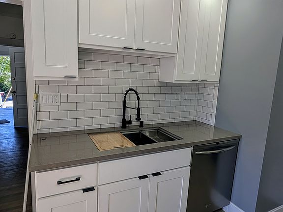 Kitchen downstairs with dishwasher , garbage disposal