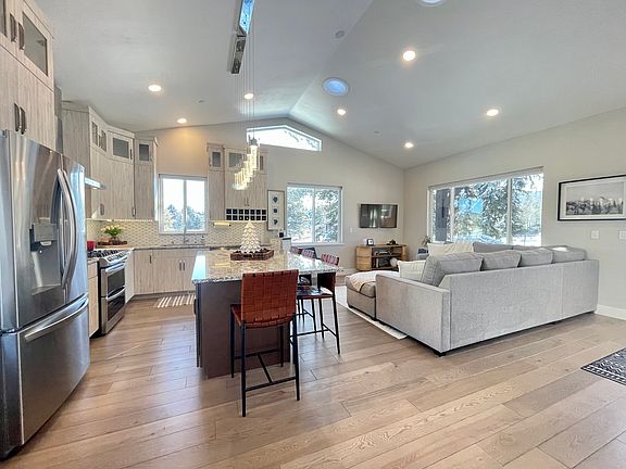 Open floor plan with high vaulted ceilings