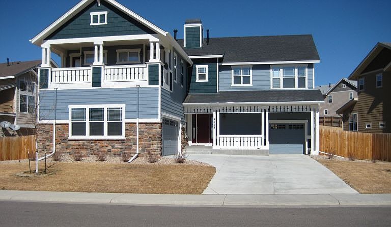 Notice the master balcony over main garage (yes, there are two garages).