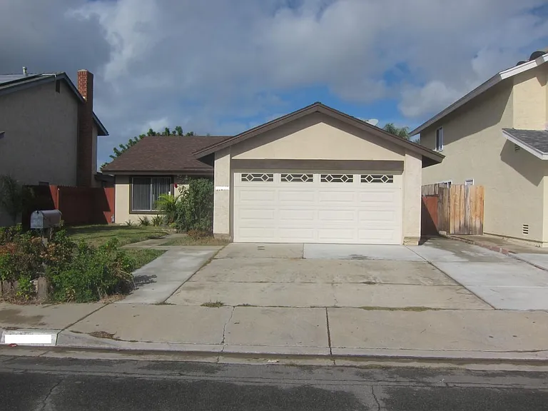 Front of house with driveway. Street parking available as well.