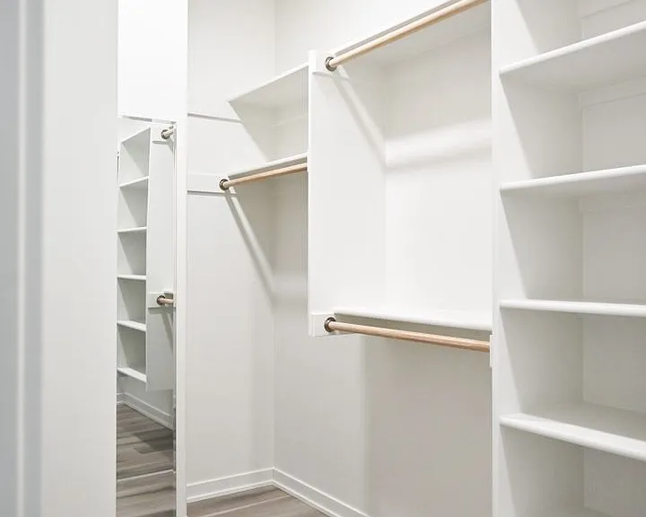 Large walk-in closet and mirror attached to master bedroom.